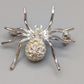 Elegante Spinnenbrosche – Glitzerndes Design mit Strasssteinen