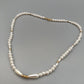 Elegante Perlenkette – Klassisches Design mit goldenen Akzenten