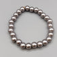 Elegantes Perlenarmband – Stilvolles Design in Grau