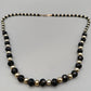 Elegante Perlenkette – Klassisches Design in Schwarz und Gold
