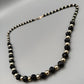 Elegante Perlenkette – Klassisches Design in Schwarz und Gold