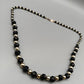 Elegante Perlenkette – Klassisches Design in Schwarz und Gold