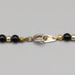 Elegante Perlenkette – Klassisches Design in Schwarz und Gold