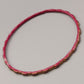 Eleganter Armreif – Stilvolles Design in Rot und Gold