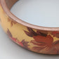 Eleganter Armreif – Florales Design in Warmen Farben