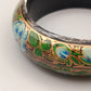 Eleganter Armreif – Kunstvolles Design in Schwarz, Blau und Grün