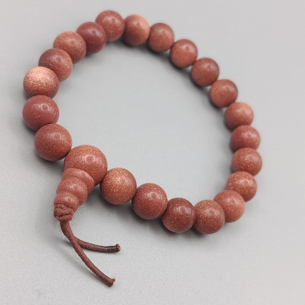 Elegantes Sonnenstein Perlenarmband – Glänzend