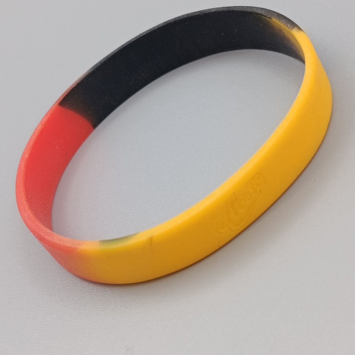 Elastisches Silikon Armband – Schwarz Rot Gelb