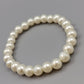 Klassisches Perlenarmband – Elastischer Modeschmuck in Weiß