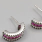 Elegante Noolani Ohrstecker mit pinken Steinen – Glänzend