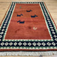Indischer Gabbeh Teppich Handgeknüpft Rostrot Tiermotive 150x93 cm