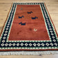 Indischer Gabbeh Teppich Handgeknüpft Rostrot Tiermotive 150x93 cm