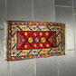 Orientteppich handgeknüpft Yürük Wolle antik Muster 78 × 45 cm