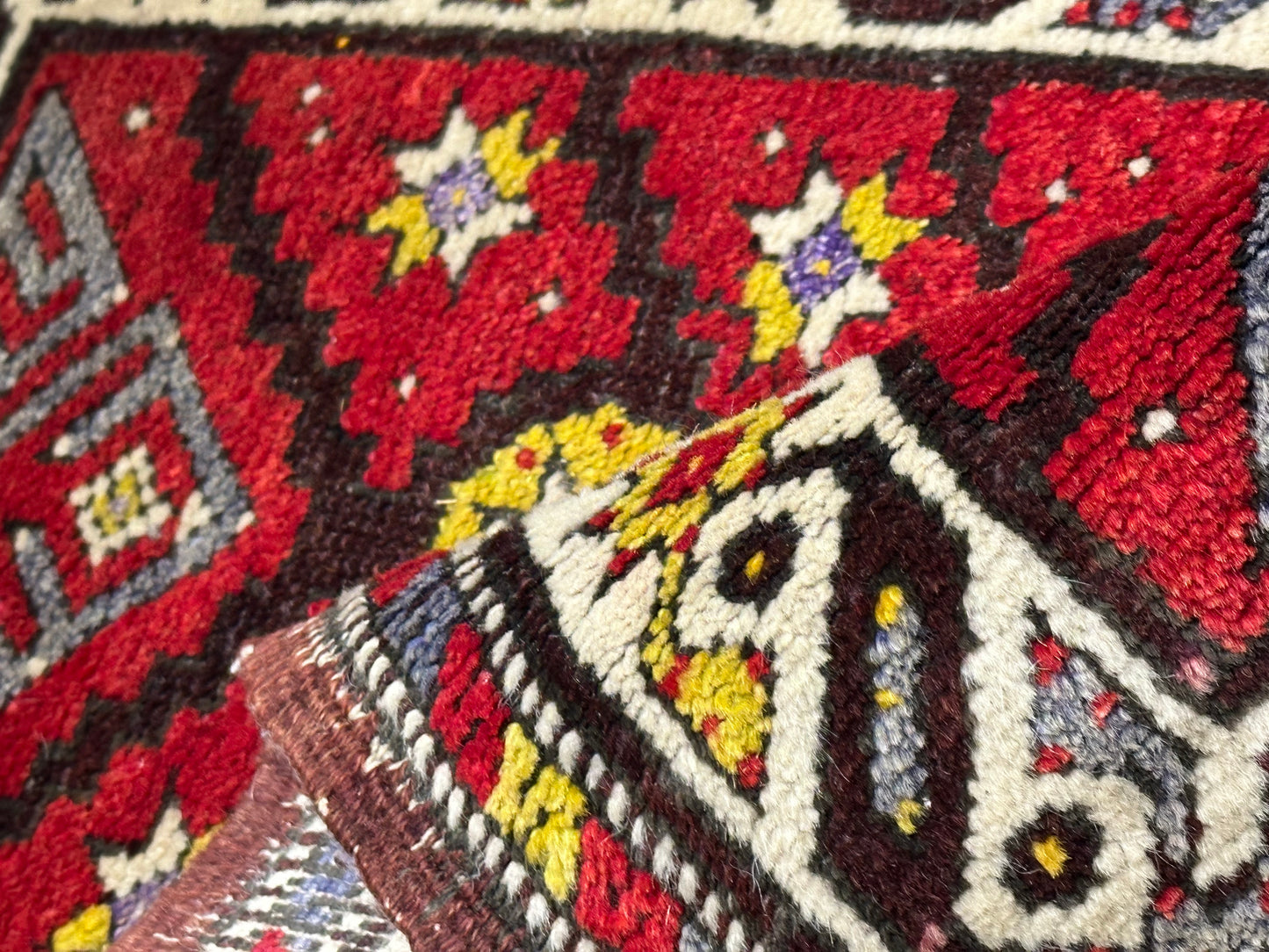 Orientteppich handgeknüpft Yürük Wolle antik Muster 78 × 45 cm
