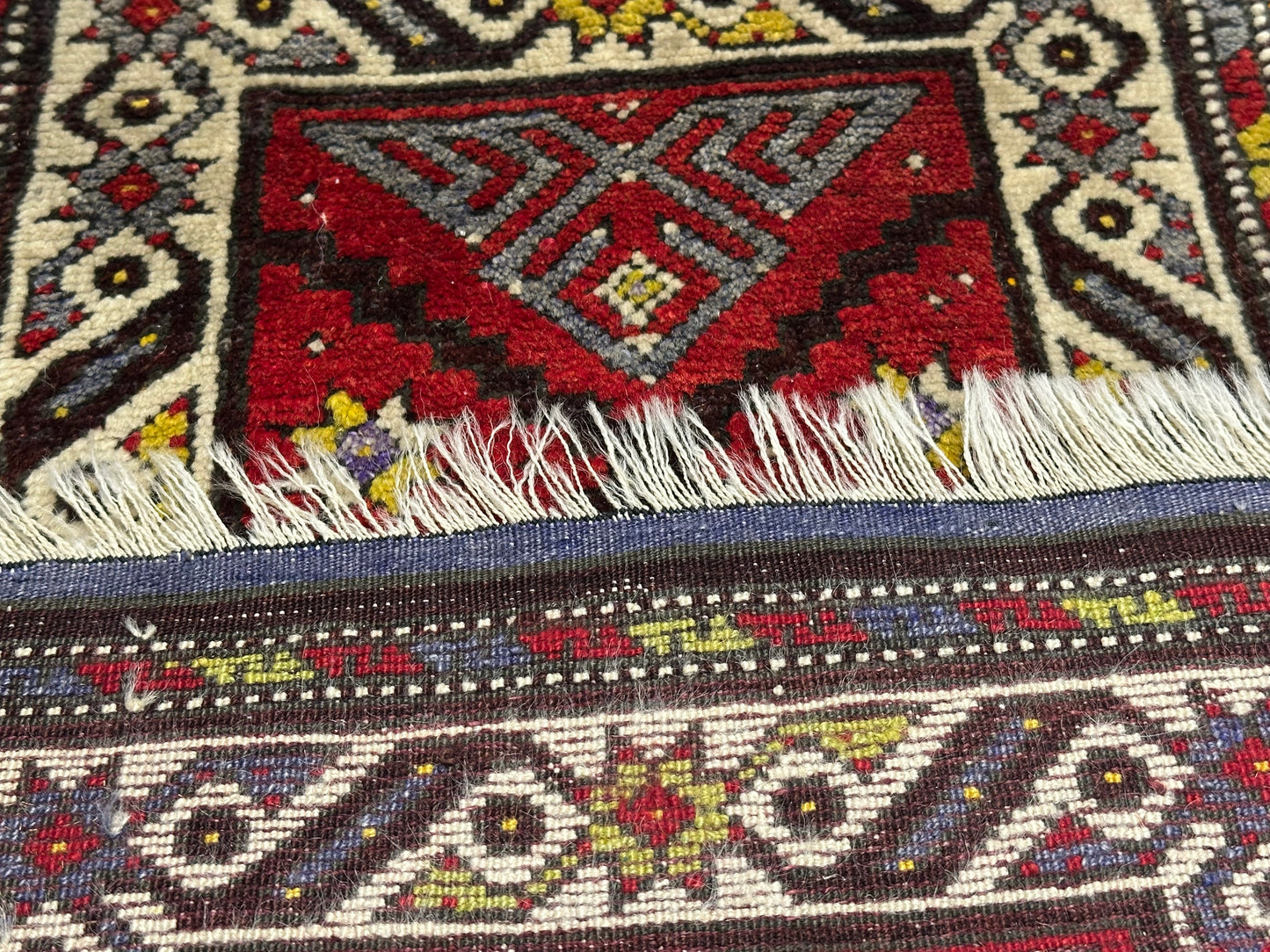 Orientteppich handgeknüpft Yürük Wolle antik Muster 78 × 45 cm